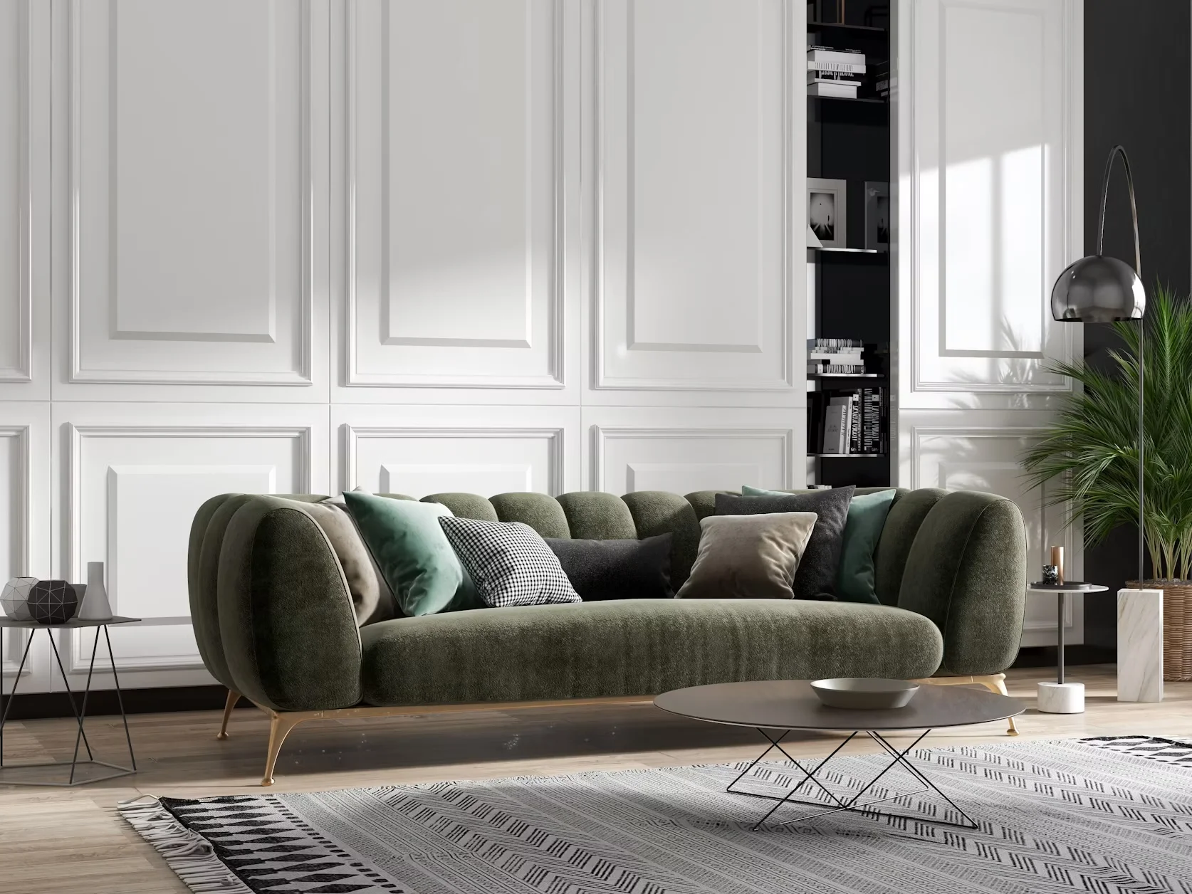 A living room with a green velvet sofa, white paneled walls, and a round coffee table